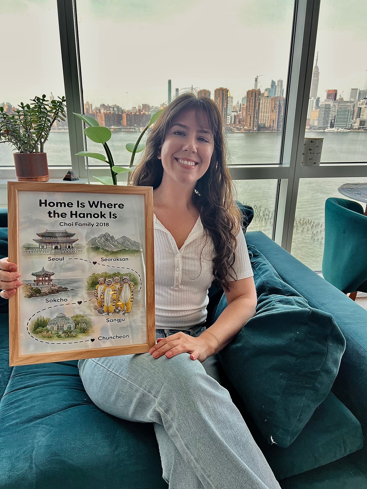 Anne Marie holding a framed StoryMap titled From City to Skye.